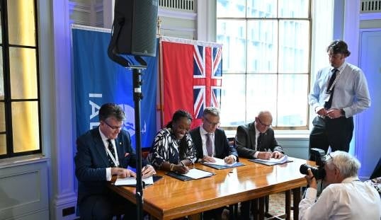 Rear Admiral Iain Lower (left) and Commodore Mike Bullock (right) during the signing of a Memorandum of Understanding between Trinity House, the Department for Transport (DfT), the IALA World Wide Academy and the Northern Lighthouse Board (NLB). Also present are Lola Fadina, director of maritime at the DfT and Vice Admiral Vincent Denamur, dean of the Academy. Image: Trinity House
Image:Rear Admiral Iain Lower (left) and Commodore Mike Bullock (right) during the signing of a Memorandum of Understanding between Trinity House, the Department for Transport (DfT), the IALA World Wide Academy and the Northern Lighthouse Board (NLB). Also present are Lola Fadina, director of maritime at the DfT and Vice Admiral Vincent Denamur, dean of the Academy. Image: Trinity House
