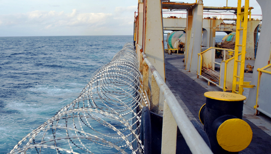 Barbed wire on a ship's hull, superstructure and railings, to protect crew against piracy attacks in the Gulf of Guinea, West Africa. Image: Lucia Gajdosikova/Getty Images - stock photo Image:Barbed wire on a ship's hull, superstructure and railings, to protect crew against piracy attacks in the Gulf of Guinea, West Africa. Image: Lucia Gajdosikova/Getty Images - stock photo
