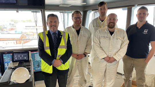 Royal Fleet Auxiliary Liaison Officer Sean Turner, right, and Nautilus International national organiser Steve Doran, left, with crew onboard the Proteus. Image: Nautilus International Image:Royal Fleet Auxiliary Liaison Officer Sean Turner, right, and Nautilus International national organiser Steve Doran, left, with crew onboard the Proteus. Image: Nautilus International