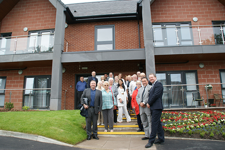 Image: group shot at the opening of John Fay House